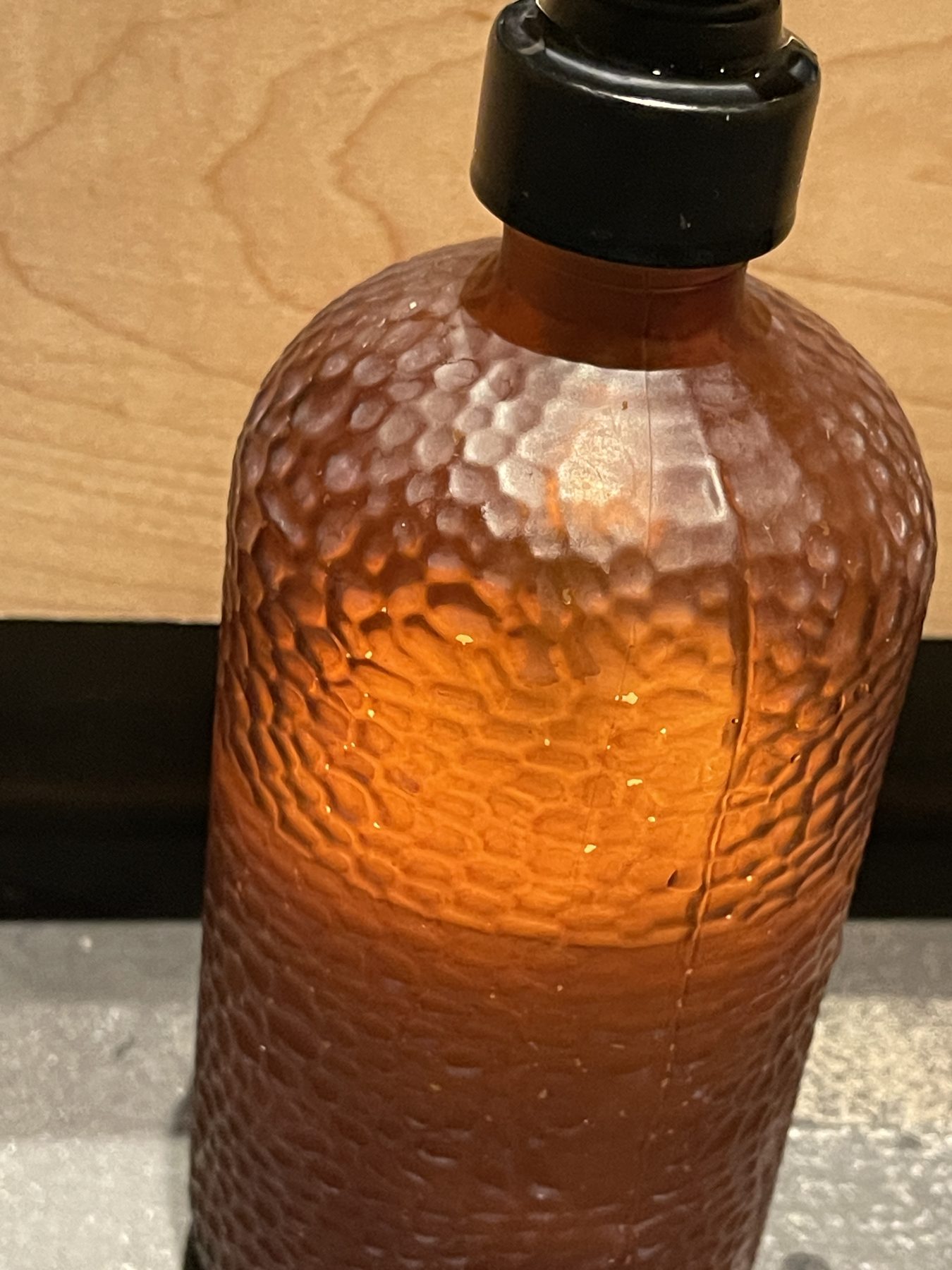Amber-colored translucent glass diffusing the contents within